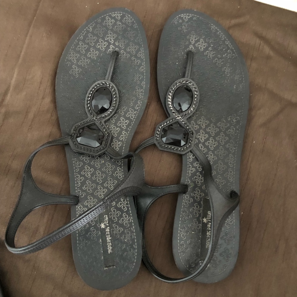 Well worn black sandals